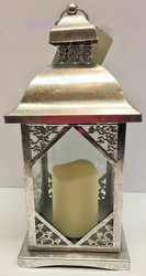 Silver lantern with candle from Krupp Florist, your local Belleville flower shop