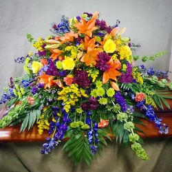 Colorful casket spray cs17-01 from Krupp Florist, your local Belleville flower shop