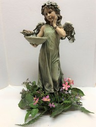 Angel with bird bath adorned with silk flower ring from Krupp Florist, your local Belleville flower shop