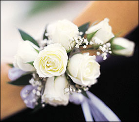 7 White Mini Roses Wristlet from Krupp Florist, your local Belleville flower shop